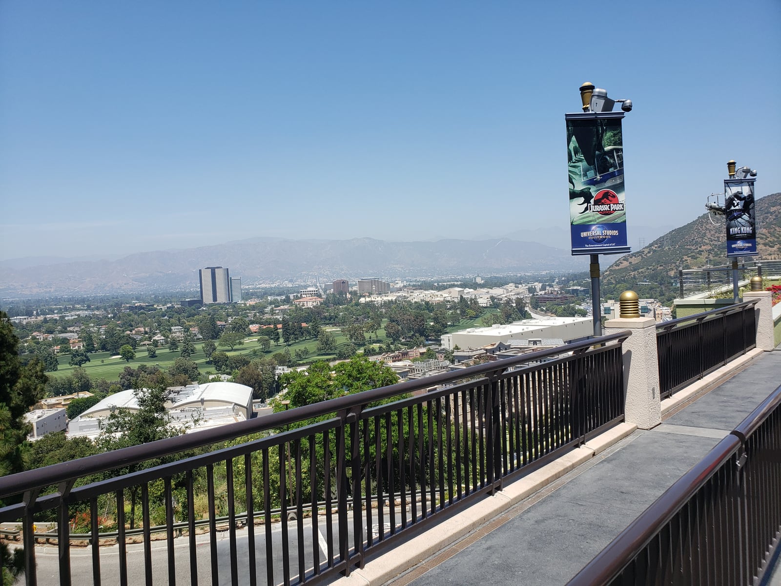 A view across the Los Angeles area from Universal Studios, with buildings, trees and distant hills.